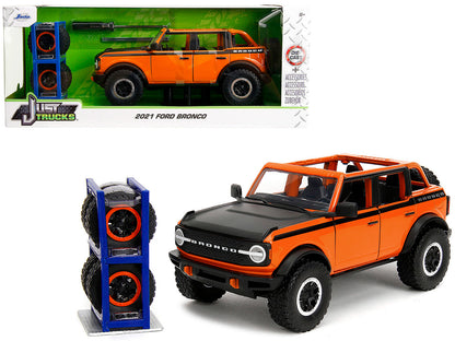 2021 Ford Bronco Open-Top Orange with Black Stripes and Hood with Extra Wheels "Just Trucks" Series 1/24 Diecast Model Car by Jada  free shipping USA