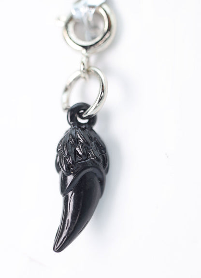 Traveler's Trinkets: Dragon Fang Charm