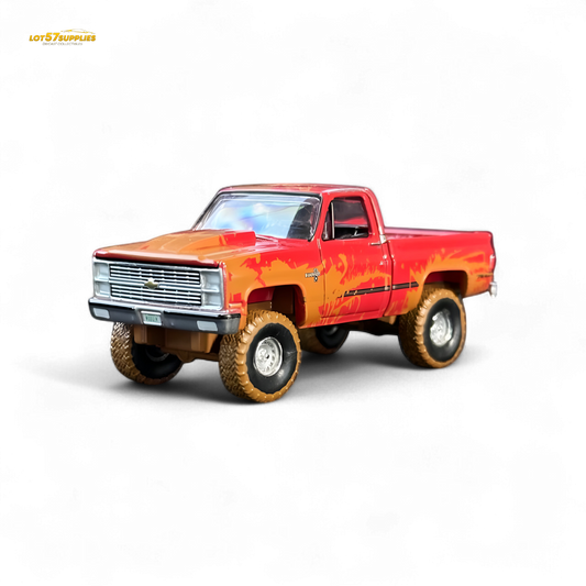 Auto World 1983 Chevrolet Silverado K10 4x4 Muddy Lifted 1:64
