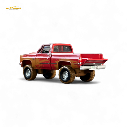 Auto World 1983 Chevrolet Silverado K10 4x4 Muddy Lifted 1:64